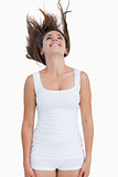 Smiling woman standing with her hair elevated