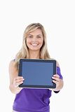 Tablet computer being held by a blonde woman