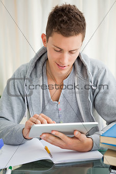 Smiling student using a touch pad 