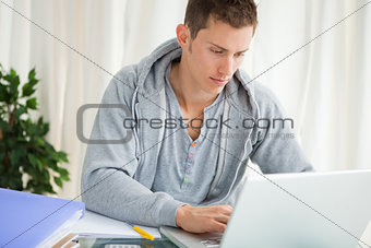 Portrait of a student using a laptop