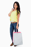 Smiling Latin student with shopping bags