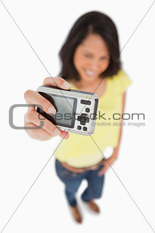 Young woman taking a picture of herself