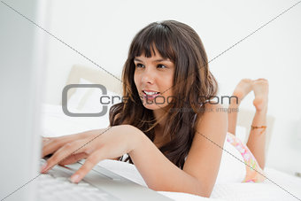 Young woman chatting on a laptop