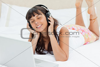 Student in pajama enjoying music