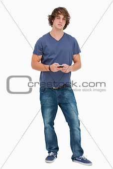 Handsome student holding a cellphone
