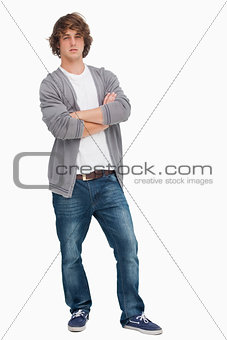 Male student posing with crossed arms