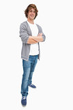 Smiling male student posing in jeans