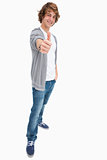 Happy male student posing the thumb-up