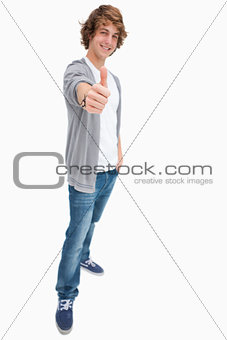 Happy male student posing the thumb-up