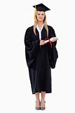 Blonde student in graduate robe holding her diploma