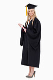 Blonde student in graduate robe holding a diploma