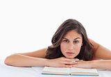 Frowning student head on her books