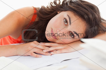 Portrait of a beautiful student head on her homeworks