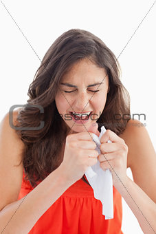Close-up of a student tearing her homeworks