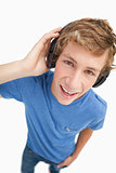 Fisheye view of a blond student wearing headphones
