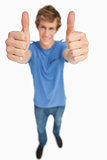 Fisheye view of a male student thumbs-up