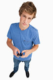 Fisheye view of a young man holding a smartphone