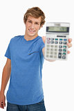 Smiling young man showing a calculator