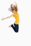 Blonde woman in yellow shirt jumping