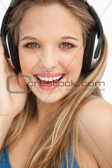 Portrait of a beautiful young blonde wearing headphones