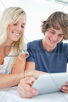 Close up of a couple using a tablet