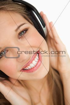 Close-up of a beauty listening to music