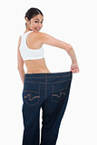 Rear view of a happy woman who lost a lot of weight