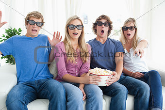 Friends shocked as they watch a scary 3d movie