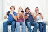 A group of friends playing video games together