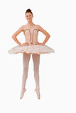 Smiling ballerina standing on her tiptoes