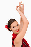 Smiling woman with her arms raised
