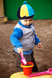 Boy Playing in Sandbox