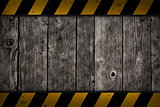wooden background with warning bar