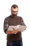 Young man reading magazine