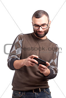 Young man playing games on smartphone