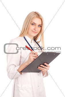 Young doctor writing in clipboard
