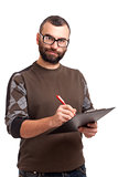 Young man writing on a clipboard