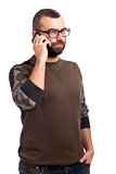 Young man with beard using cell phone
