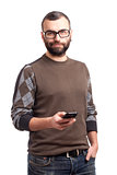 Young man with beard holding cell phone