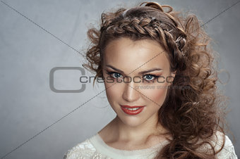 Woman curly hair on a gray background