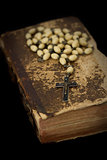 Ancient book with prayer beads 