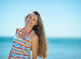 Portrait of smiling young woman on beach