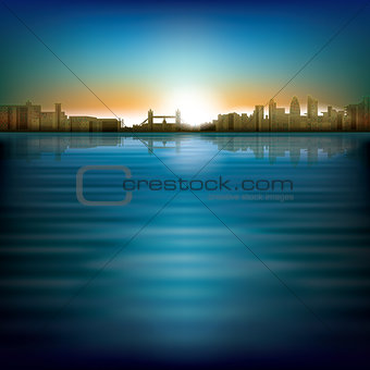 abstract background with sunrise and silhouette of city