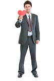 Full length portrait of modern man in business suit with paper h