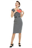 Full length portrait of modern woman holding heart shaped postca