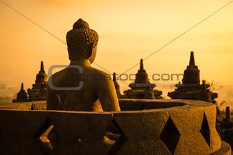 Buddha in Borobudur Temple at sunrise. Indonesia. 