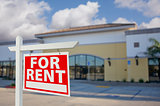 Vacant Retail Building with For Rent Real Estate Sign