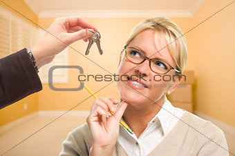 Woman Being Handed Keys in Empty Room with Boxes