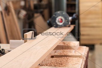 Beech plank and a router