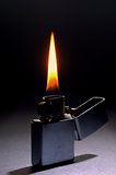 Lighting flame on dark background